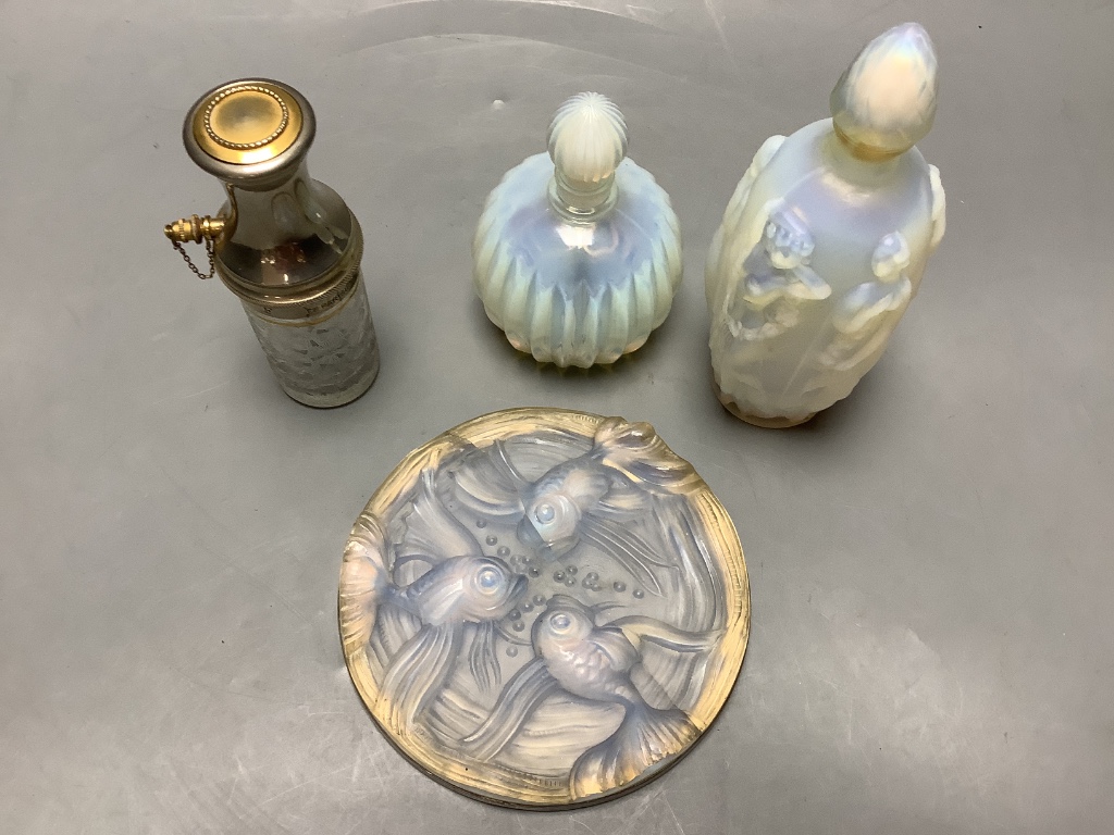 A collection of Sabino and other glass scent bottles and a plaque